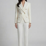 A professional woman wearing a sophisticated cream white double-breasted tweed blazer, featuring elegant gold buttons, a tailored slim fit, and classic flap pockets for a polished executive look.