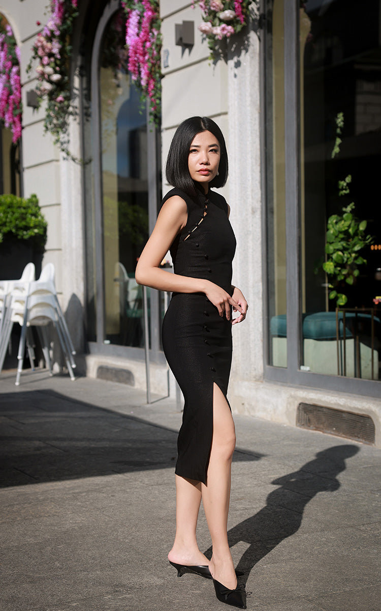 Side view of the black modern Cheongsam dress highlighting the tasteful side slit for ease of movement and a subtly alluring silhouette.
