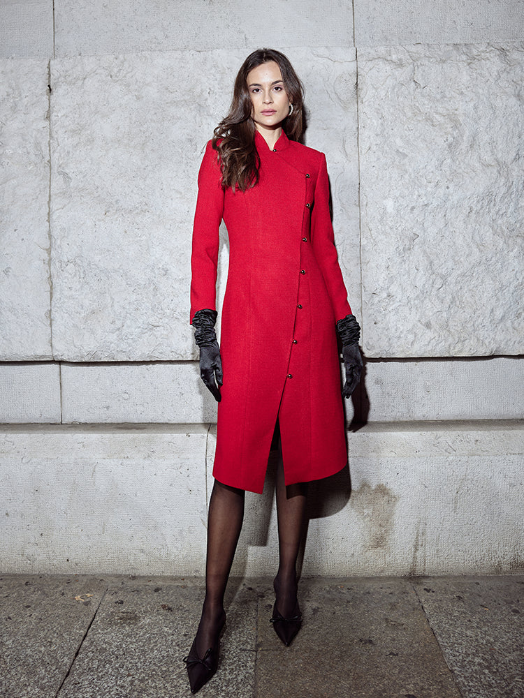 Tailored red coat with an X-line design to accentuate slimming and height-enhancing features, detailed with a seductive neckline and a flared hem for an elegant silhouette.