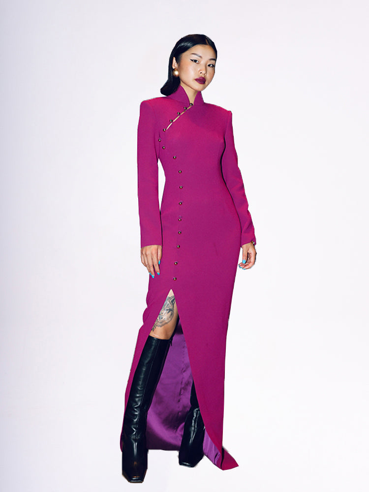 Model in SENSE BY MEI's rose-purple qipao slit dress with golden button details.