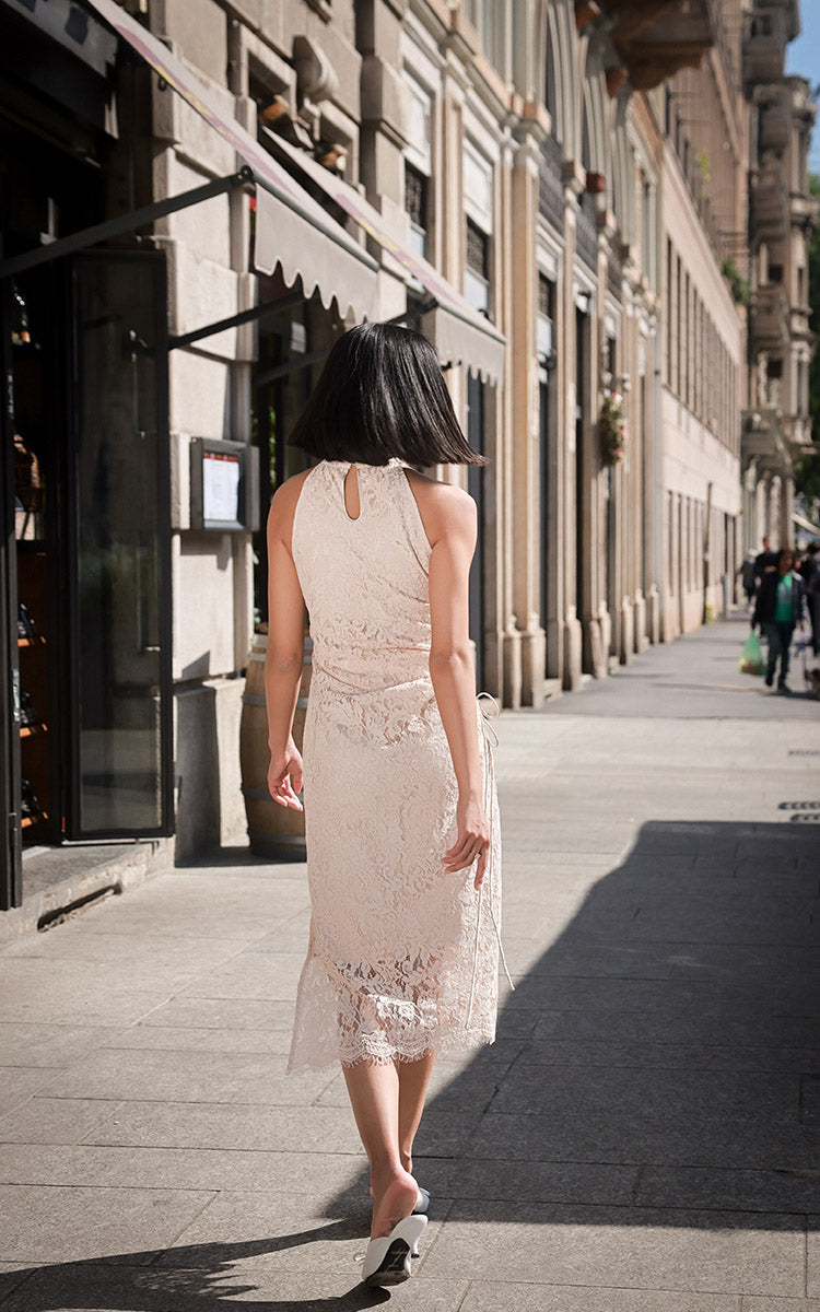 Back view of the white off-shoulder Cheongsam, displaying the seamless blend of traditional allure with a contemporary chic design.