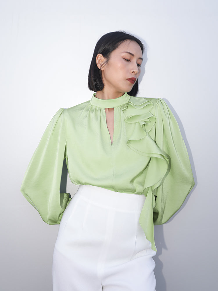 Front view of an elegant green satin blouse with ruffled collar and voluminous sleeves by SENSE by Mei.