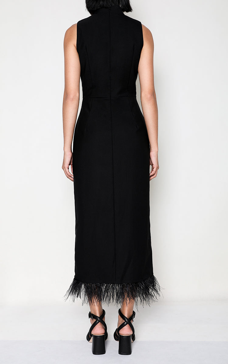 Back view of the elegant long black Cheongsam dress, emphasizing the luxurious ostrich feather accents and the seamless fusion of Eastern and Western design elements