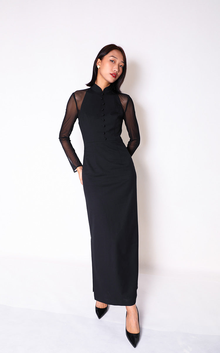 Model in a pure black mesh spliced modern Cheongsam long dress by BBM, showcasing a slim fit and elegant silhouette against a white background.