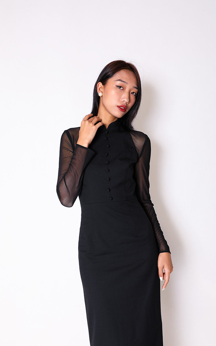 Close-up front view of a model in a black mesh spliced Cheongsam, highlighting the intricate detailing and BBM's signature slim fit tailoring.