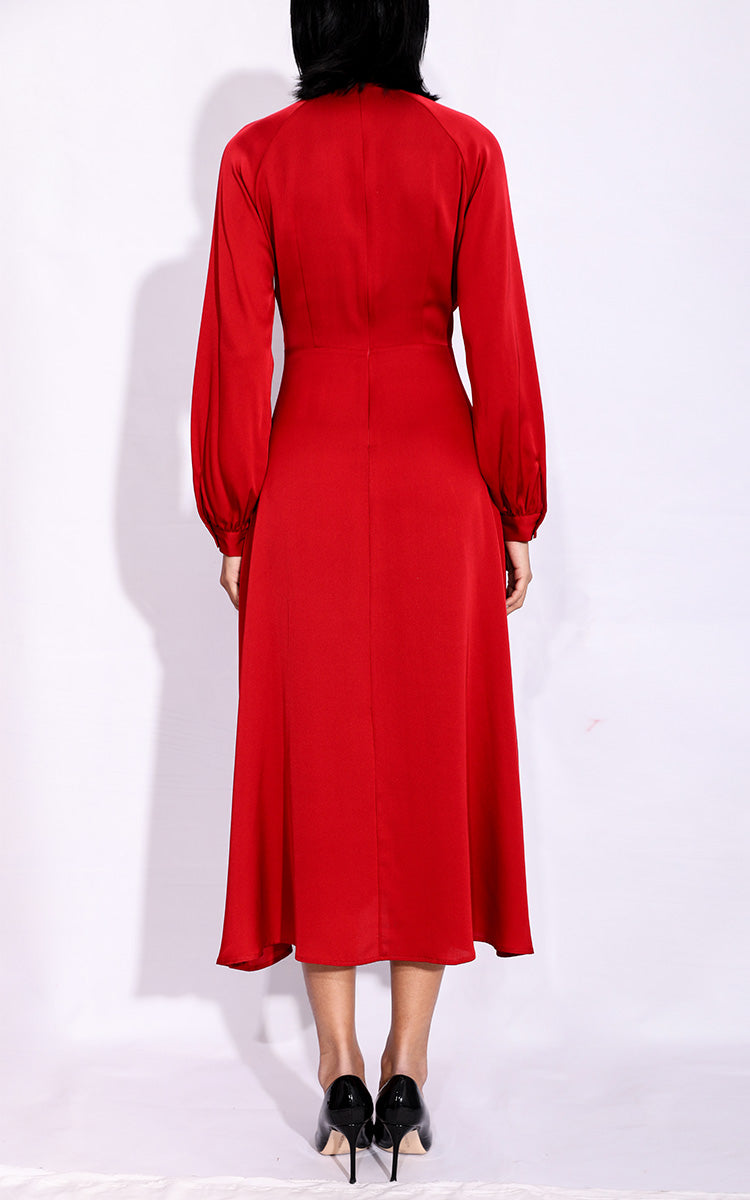 Back view of a pure red silk Cheongsam dress, revealing the meticulous cut and traditional Mandarin collar against a white backdrop.