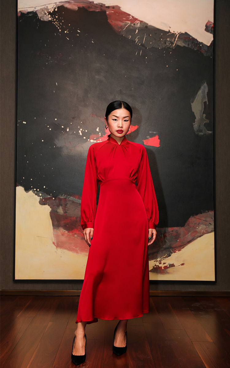 Front view of a model showcasing the sleek design and high-waisted cut of a vibrant red silk modern Cheongsam dress.