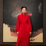 Front view of a model showcasing the sleek design and high-waisted cut of a vibrant red silk modern Cheongsam dress.