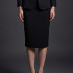 A professional woman wearing a sophisticated high-waisted pencil skirt in a cream white color, featuring a tailored slim fit and knee-length hem for an elegant office look.