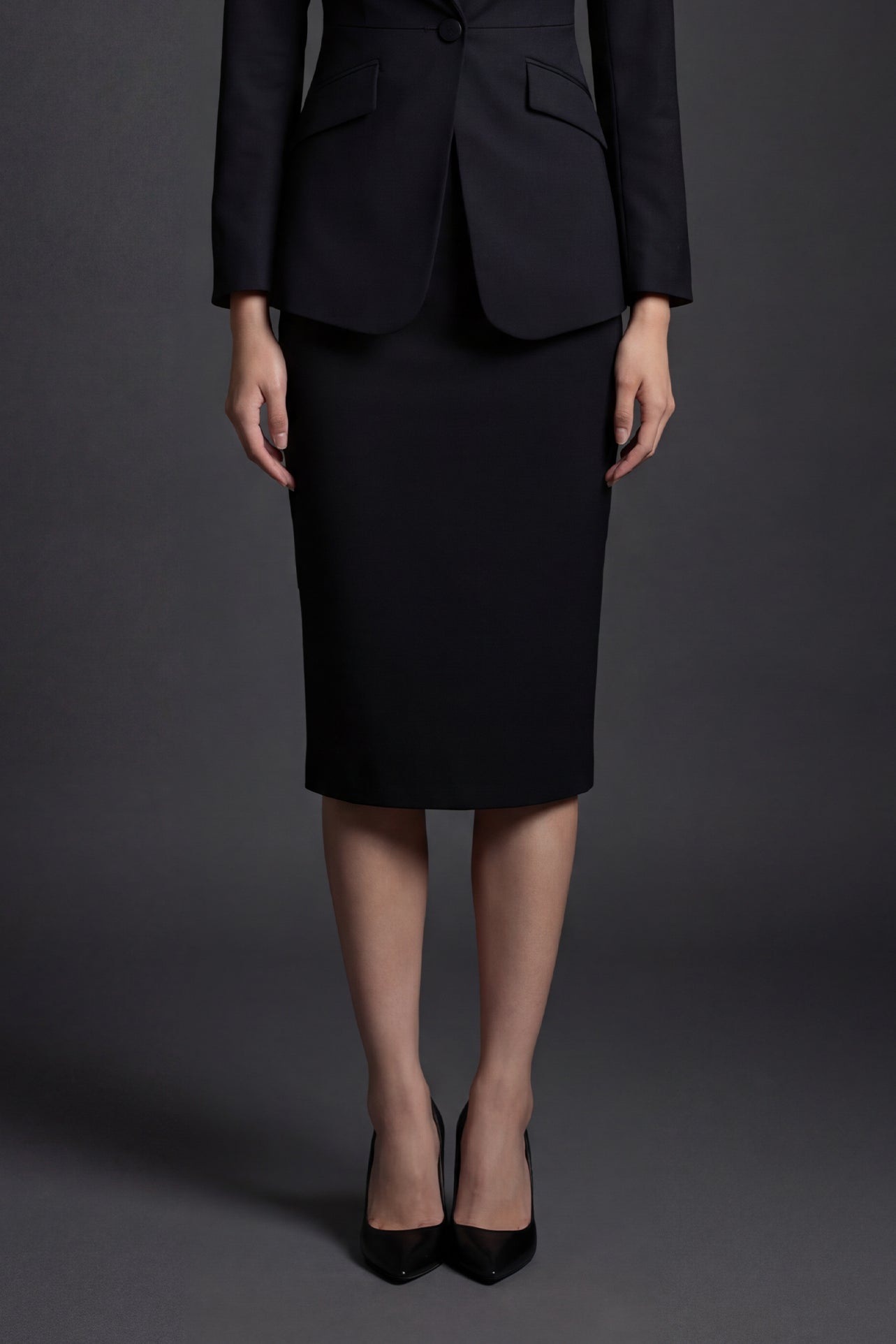 A professional woman wearing a sophisticated high-waisted pencil skirt in a cream white color, featuring a tailored slim fit and knee-length hem for an elegant office look.