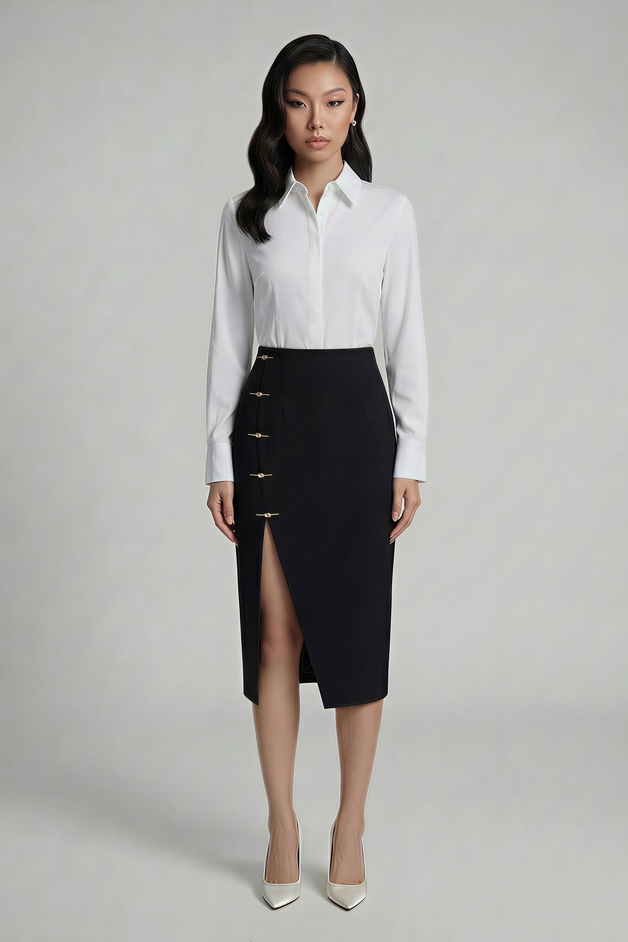 A professional woman wearing a sophisticated high-waisted black pencil skirt, featuring elegant gold-tone mandarin-style buttons and a stylish side slit for a polished executive office look.