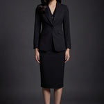 A professional woman wearing a sophisticated black belted blazer dress, featuring a tailored slim-fit silhouette with a waist-defining belt for a powerful executive business look.