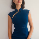 A collection of four professional models of different ages wearing elegant royal blue dresses featuring modern Chinese elements, including mandarin collars, traditional knot buttons, and diverse silhouettes from sleek sheaths to pleated A-line skirts.