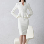 A professional woman wearing a sophisticated cream tweed skirt suit, featuring a tailored jacket with a modern front zipper and an elegant stand collar for a polished executive office look.