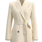 A professional woman wearing a sophisticated cream pinstripe blazer, featuring a double-breasted front with a chic waist-tie belt and notched lapels for a polished old money office look.