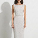 A collection of two professional models wearing elegant white lace midi dresses; the left showcasing a minimalist sleeveless bateau neck sheath dress, and the right featuring a modern Chinese qipao with a sophisticated capelet sleeve detail and traditional mandarin collar.