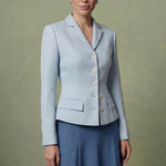 A professional woman modeling a sophisticated light blue tailored blazer with white buttons, perfectly paired with a contrasting navy blue pleated midi skirt for a refined business look.