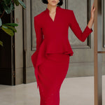 A style comparison of two elegant women's high-waisted pencil midi skirts featuring a delicate gradient of sparkling rhinestones at the hemline; shown on the left in deep red paired with a white shirt, and on the right in pale ice-blue paired with a matching peplum top.