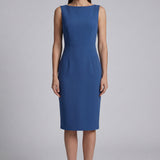 A professional woman wearing a sophisticated teal blue midi dress with an elegant cape-style overlay and structured shoulders, perfect for formal executive events and ceremonial occasions.