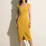 A professional woman modeling an elegant mid-blue midi dress featuring a structured square neckline, delicate cap sleeves, and a flattering high-waisted A-line flare skirt for a sophisticated summer look.