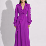 A style comparison of two elegant long-sleeve chiffon maxi dresses; the left showcasing a vibrant purple dress with a deep V-neckline and tiered ruffles along the sleeves, and the right featuring a sophisticated grey version styled with a matching neck scarf and smocked waistband.