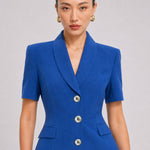 A style comparison of two professional summer short-sleeve blazers featuring an elegant shawl collar, three-button front, and flap pockets; the left shown in vibrant royal blue and the right in sophisticated light beige.
