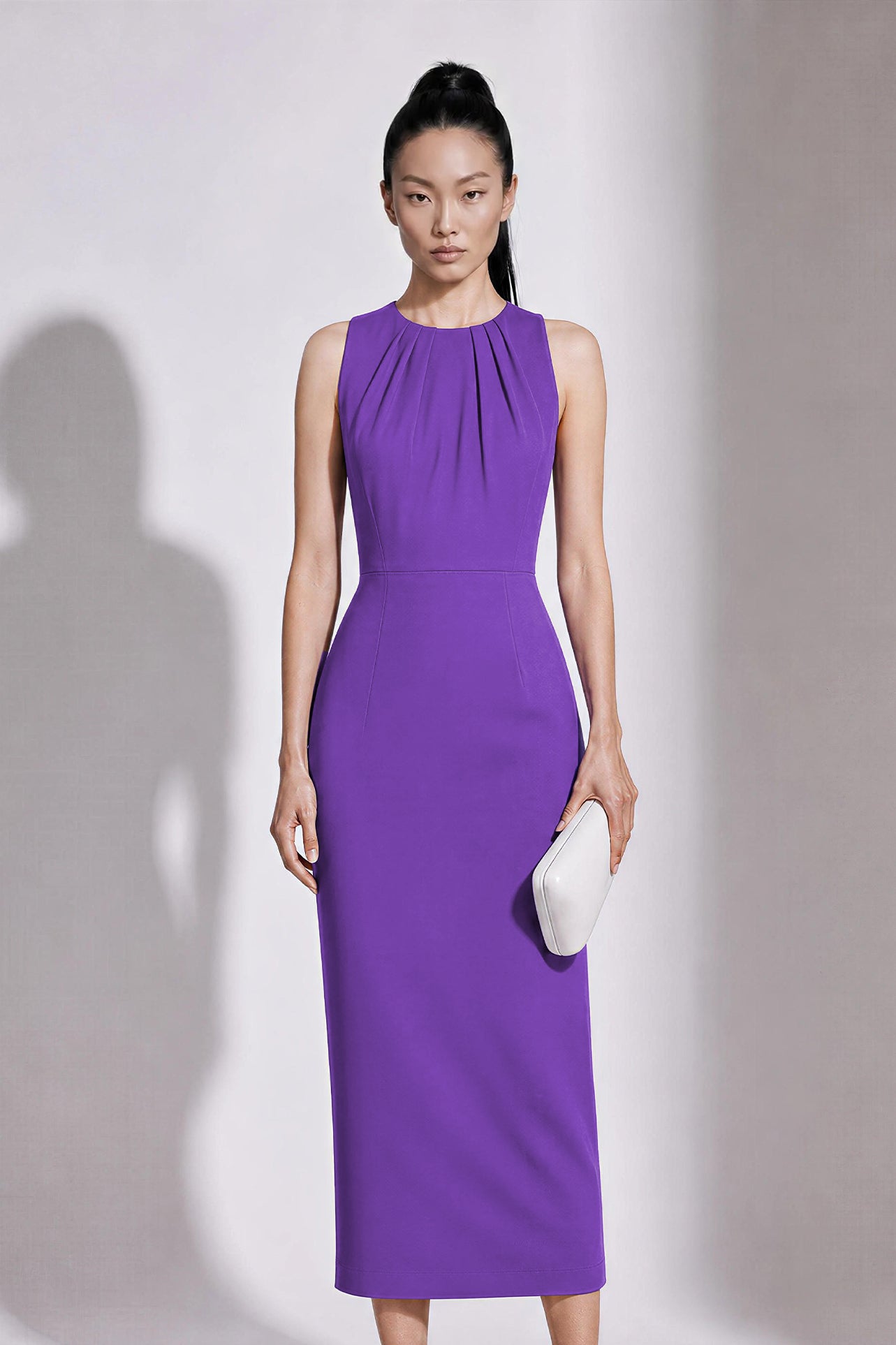 A style comparison of two elegant tailored office sheath midi dresses; the left showcasing a structured vibrant purple dress with a collared capelet sleeve design, and the right featuring a minimalist light grey sleeveless dress with subtle pleated neckline and side pockets.