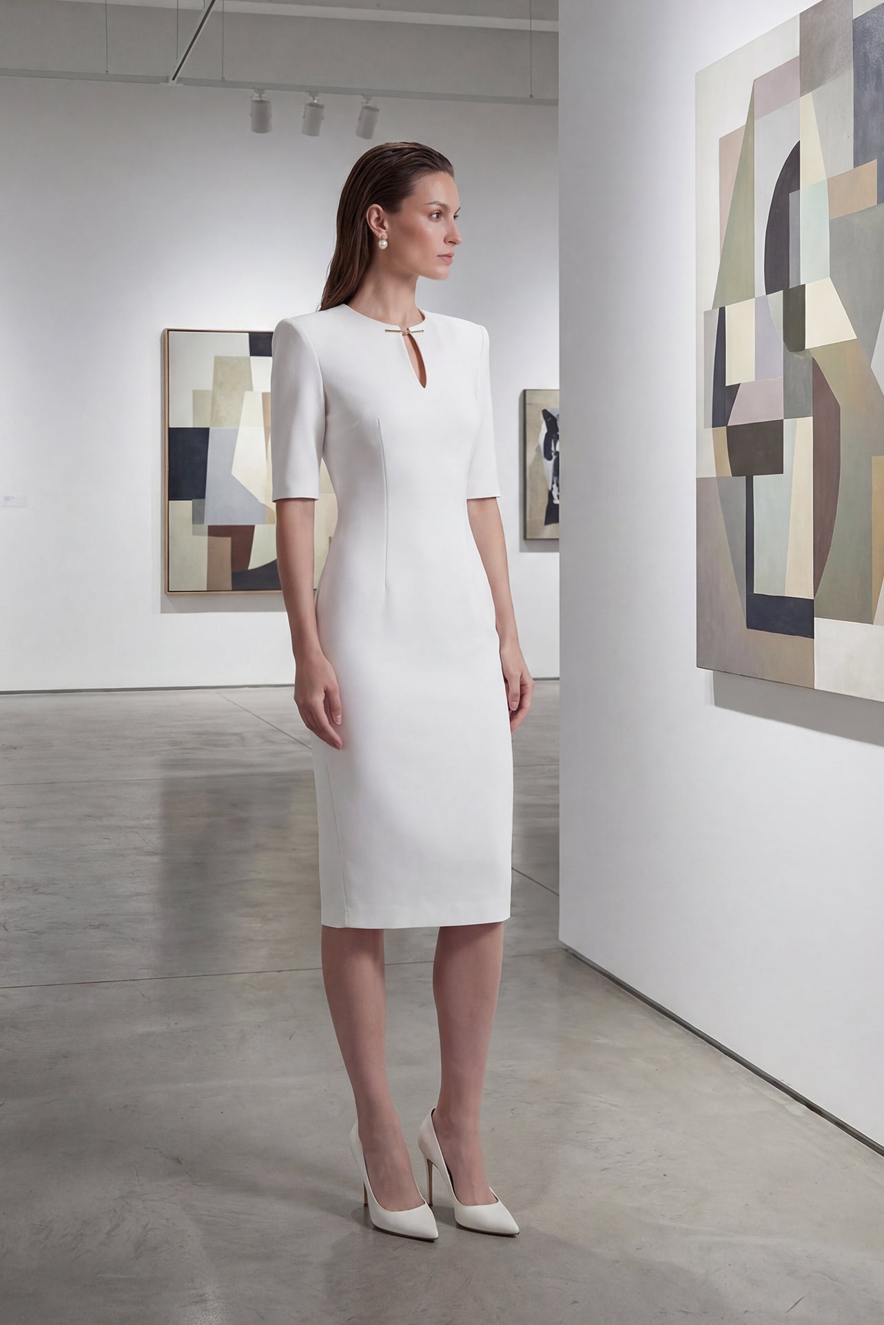 A sophisticated professional woman wearing a tailored black longline blazer with a belted waist and gold buckle, featuring a slimming executive silhouette for a formal office look.