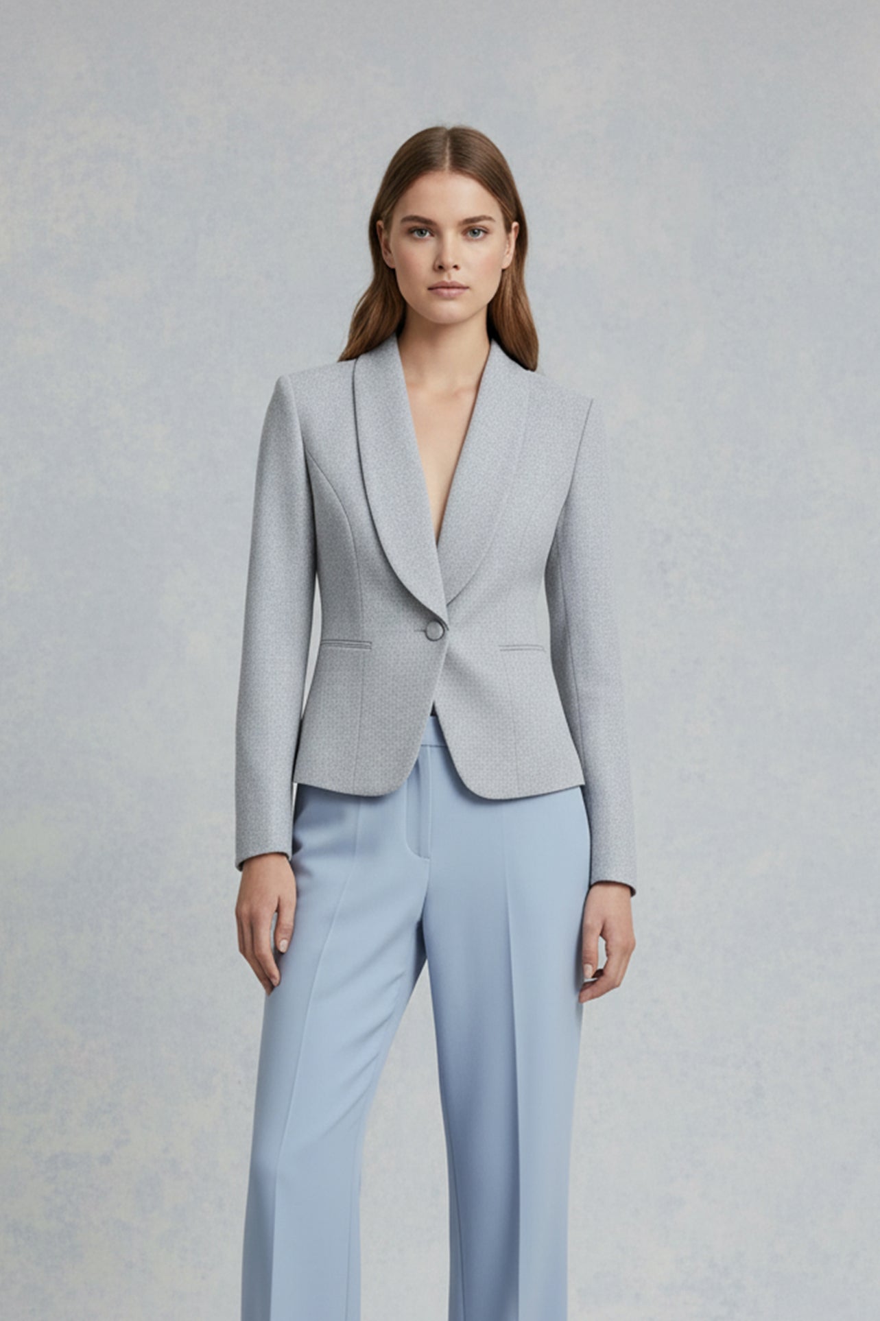 A professional woman wearing a sophisticated burgundy blazer suit with a classic shawl lapel and a white turtleneck, perfect for a high-end executive office look.