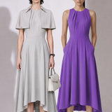 A style comparison of two elegant tailored midi dresses with a flowing high-low hem; the left showcasing a sophisticated light grey dress with a structured collared capelet sleeve, and the right featuring a vibrant purple sleeveless dress with refined pleated neckline and side pockets.