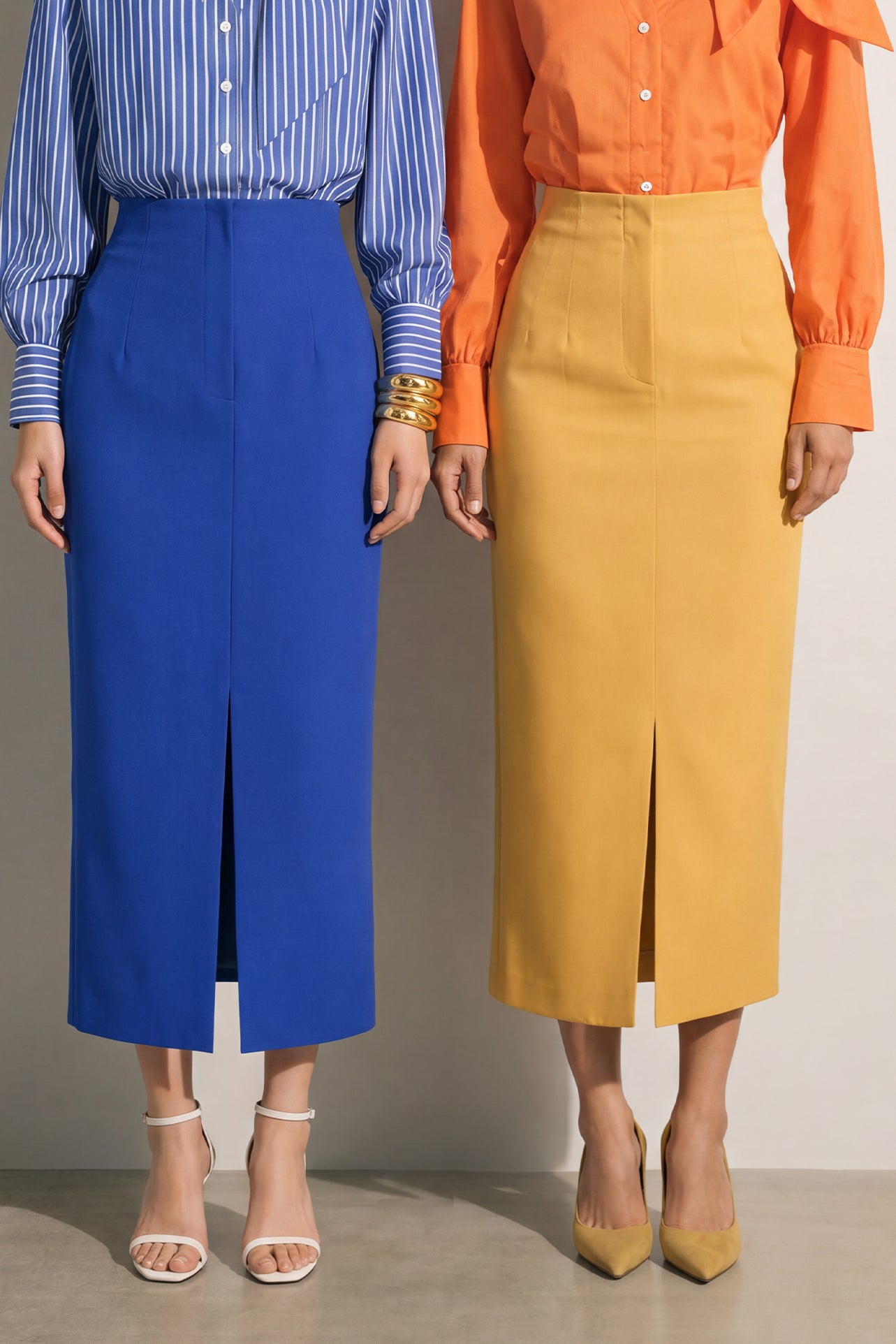 A style comparison of two elegant tailored midi pencil skirts with a sharp front slit; the left showcasing a vibrant royal blue high-waisted skirt paired with a striped shirt, and the right featuring a rich mustard yellow version paired with a bright orange blouse.