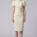 A professional woman wearing a sophisticated pale yellow short-sleeve midi dress, featuring elegant puff sleeves and a slimming ruched waistline for a polished and fresh summer office look.