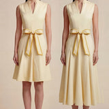 A side-by-side comparison of an elegant pale yellow sleeveless dress in two lengths, featuring a sophisticated mandarin collar, a stylish bow tie-waist, and a pleated A-line skirt for a classic feminine look