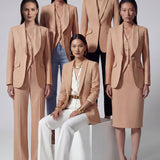 A professional woman wearing a sophisticated apricot-colored tailored vest, featuring a deep V-neckline and a unique pointed hem for an elegant executive office look.