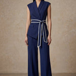 A group of elegant women wearing sophisticated modern qipao dresses in various colors like white, purple, yellow, and black, styled with luxurious fur shawls and embroidery for a high-end social gathering.