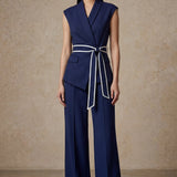 A group of elegant women wearing sophisticated modern qipao dresses in various colors like white, purple, yellow, and black, styled with luxurious fur shawls and embroidery for a high-end social gathering.