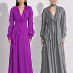 A style comparison of two elegant long-sleeve chiffon maxi dresses; the left showcasing a vibrant purple dress with a deep V-neckline and tiered ruffles along the sleeves, and the right featuring a sophisticated grey version styled with a matching neck scarf and smocked waistband.