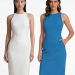 A comparison of two professional women modeling elegant halter-neck sheath dresses, one in crisp white and the other in vibrant mid-blue, featuring a tailored slim fit and side pockets for a sophisticated office or social look.