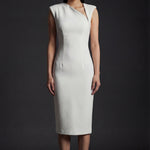 A professional woman wearing a sophisticated ivory sleeveless sheath dress, featuring a unique asymmetric zipper neckline and a tailored slim-fit silhouette for a modern executive office or cocktail look.