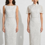 A collection of two professional models wearing elegant white lace midi dresses; the left showcasing a minimalist sleeveless bateau neck sheath dress, and the right featuring a modern Chinese qipao with a sophisticated capelet sleeve detail and traditional mandarin collar.
