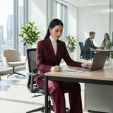 A professional woman wearing a sophisticated burgundy blazer suit with a classic shawl lapel and a white turtleneck, perfect for a high-end executive office look.