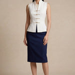 A professional woman modeling stylish high-waisted wide-leg trousers in a classic black pinstripe pattern, featuring sophisticated front pleats and a flattering long-line silhouette for an elegant office look.