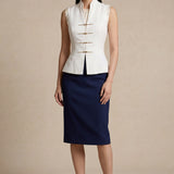 A professional woman modeling stylish high-waisted wide-leg trousers in a classic black pinstripe pattern, featuring sophisticated front pleats and a flattering long-line silhouette for an elegant office look.