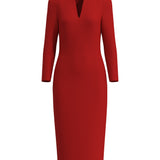 A professional woman wearing a sophisticated solid white long-sleeve sheath dress, featuring an elegant V-neckline and a slim black belt with a gold buckle for a polished executive office look.
