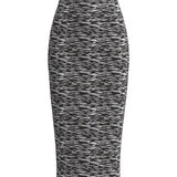 A woman wearing a glamorous high-waisted pencil skirt featuring shimmering silver and black sequins in a stylish zebra print, ideal for an elegant evening party or a night out.