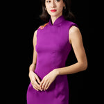A professional woman wearing a stunning purple satin sleeveless dress, featuring a traditional mandarin collar and delicate floral embroidery on the shoulder for a modern oriental-inspired formal look.