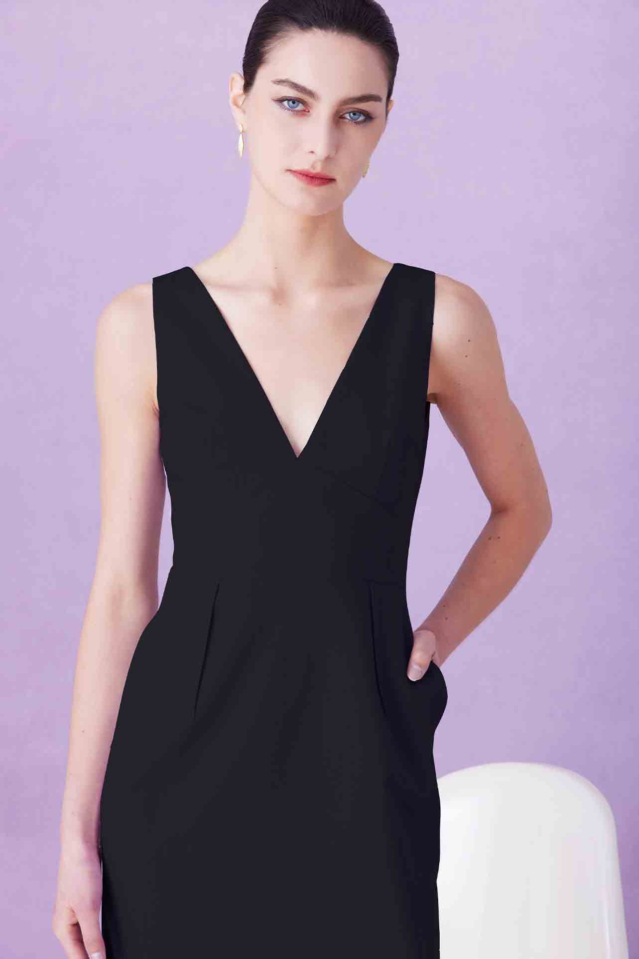 A professional woman showcasing two elegant sleeveless V-neck sheath dresses in classic black and soft lilac purple, featuring functional side pockets and a tailored fit for a polished office look.