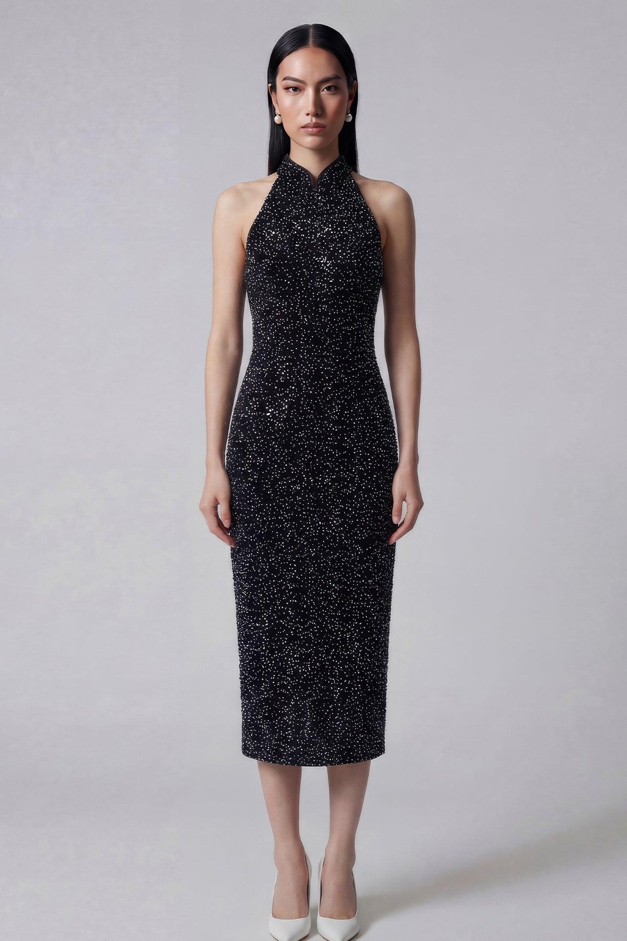 A stunning woman wearing a sophisticated black sequin halter midi dress, featuring a traditional mandarin collar and a shimmering bodycon silhouette, perfect for a modern oriental-inspired evening party look.