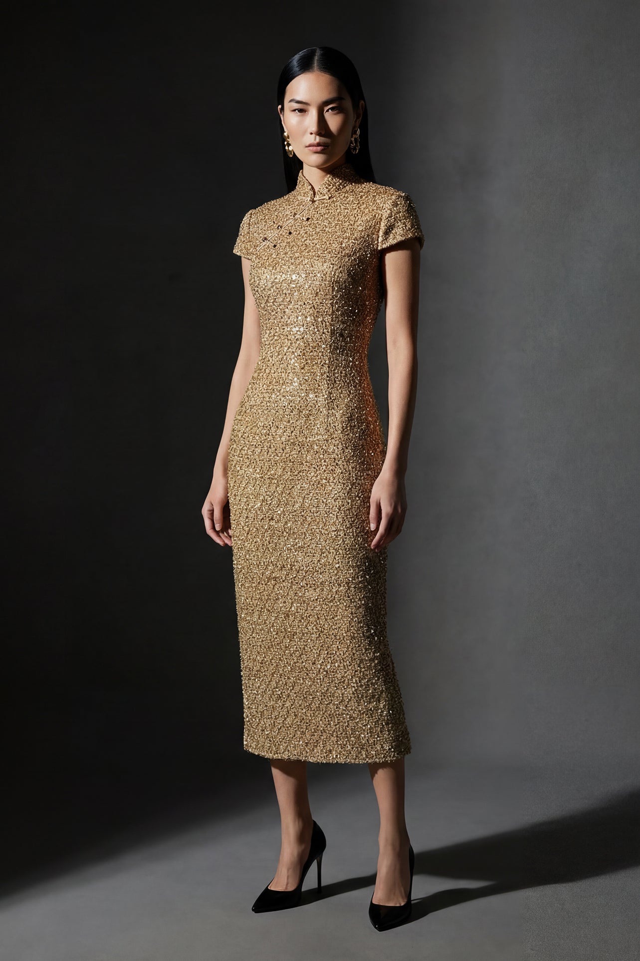 A professional woman wearing a stunning luxurious gold sequined modern qipao dress, featuring a traditional mandarin collar, short cap sleeves, and a slim-fit floor-length silhouette for a formal evening gala.