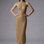 A stunning professional model wearing a luxurious gold sequined halter neck evening gown, featuring a sophisticated keyhole neckline and a slim-fit silhouette for a formal gala look.